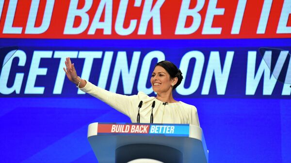 Britain's Home Secretary Priti Patel speaks on the third day of the annual Conservative Party Conference at the Manchester Central convention centre in Manchester, northwest England, on October 5, 2021.  - Sputnik International