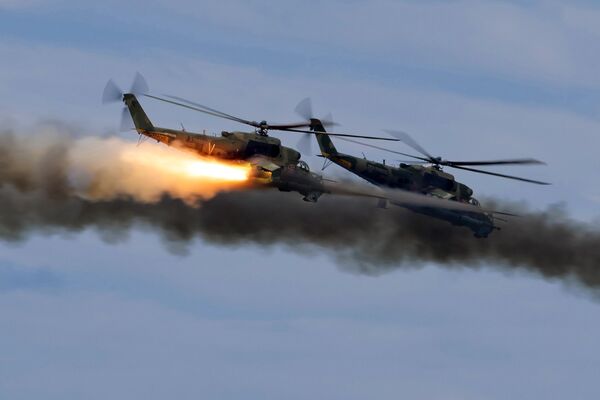 Mi-24 helicopters at the 'Vostok 2022' military maneuvers at the Sergeevsky training ground - Sputnik International