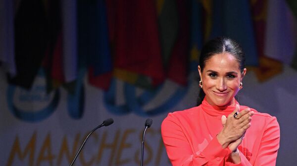 Britain's Meghan, Duchess of Sussex applauds at the end of her speech on stage during the annual One Young World Summit at Bridgewater Hall in Manchester, north-west England on September 5, 2022.  - Sputnik International