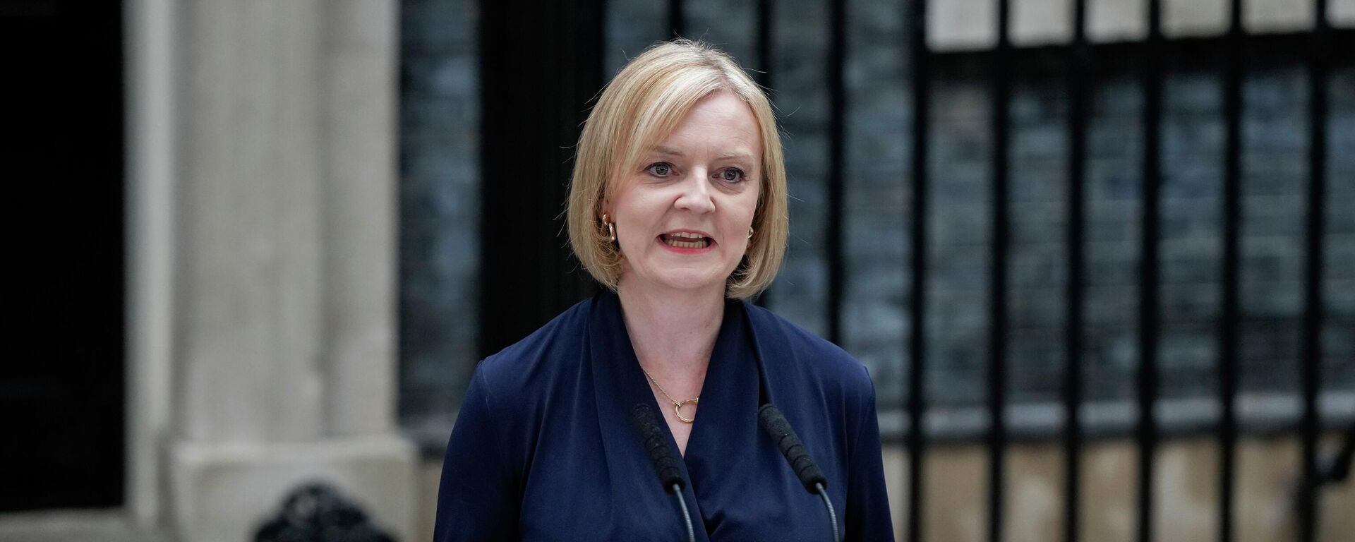 New British Prime Minister Liz Truss makes an address outside Downing Street in London, Tuesday, Sept. 6, 2022 after returning from Balmoral in Scotland where she was formally appointed by Britain's Queen Elizabeth II.  - Sputnik International, 1920, 14.10.2022