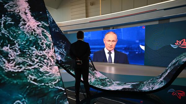 Russian President Vladimir Putin is seen on a screen as he attends the plenary session of the 2022 Eastern Economic Forum (EEF), in Vladivostok, Russia - Sputnik International