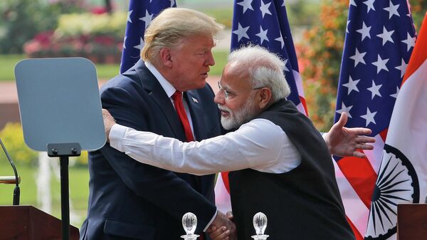 FILE - In this Feb. 25, 2020 file photo, U.S. President Donald Trump and Indian Prime Minister Narendra Modi embrace after giving a joint statement in New Delhi, India - Sputnik International