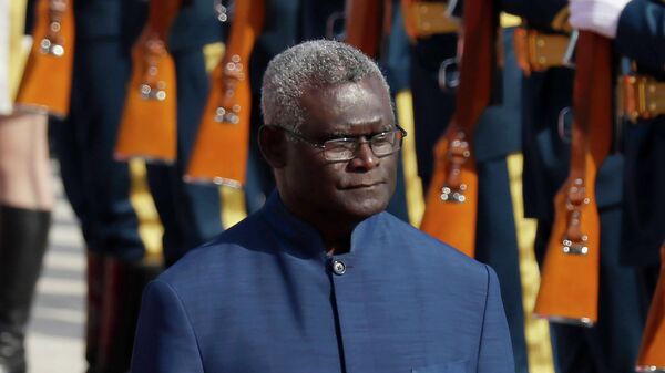 FILE - Solomon Islands Prime Minister Manasseh Sogavare reviews an honor guard during a welcome ceremony at the Great Hall of the People in Beijing, on Oct. 9, 2019 - Sputnik International