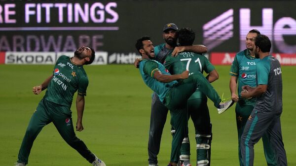 Pakistan's players celebrate their win in the T20 cricket match of Asia Cup against Afghanistan, in Sharjah, United Arab Emirates, Wednesday, Sept. 7, 2022. - Sputnik International