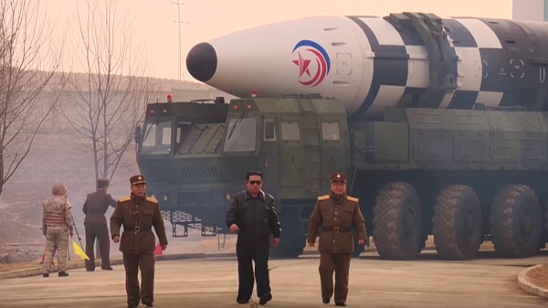 North Korean leader Kim Jong-un takes part in launch of heavy intercontinental ballistic missile test. - Sputnik International