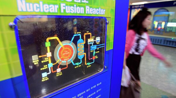 A South Korean woman passes by a diagram showing the theory of nuclear fusion reactor at the Seoul Science Park in Seoul, South Korea, Wednesday, May 12, 2010. - Sputnik International