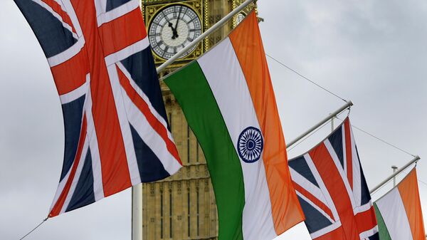 The Union and Indian flags hang near  the London landmark Big Ben  in Parliament Square in London, Thursday, Nov. 12, 2015 - Sputnik International