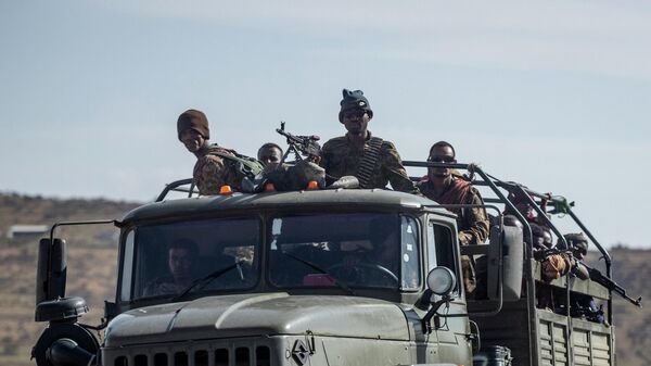 Ethiopian government soldiers ride in the back of a truck on a road near Agula, north of Mekele, in the Tigray region of northern Ethiopia on May 8, 2021. - Sputnik International