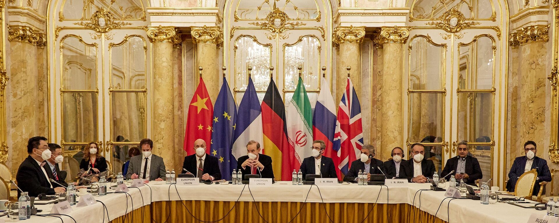 This handout photo taken and released on December 9, 2021 by the EU delegation in Vienna - EEAS shows representatives attending a meeting of the joint commission on negotiations aimed at reviving the Iran nuclear deal in Vienna, Austria. - Negotiators of the Iranian nuclear deal met on December 9, 2021, 'determined to work hard' to save the 2015 deal after the suspension of talks last week. (Photo by Handout / EU DELEGATION IN VIENNA / AFP)  - Sputnik International, 1920, 13.09.2022