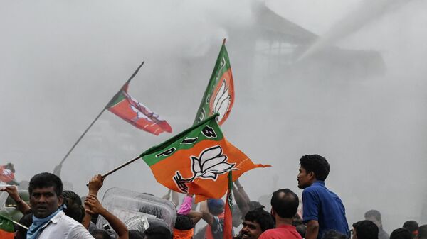 Police use a water cannon to disperse Bharatiya Janata Party (BJP) activists marching towards the state secretariat during a protest against West Bengal's government in Kolkata on September 13, 2022.  - Sputnik International
