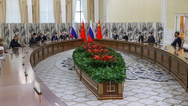 Russian President Vladimir Putin and Chinese President Xi Jinping at the Shanghai Cooperation Organization Summit in Samarkand, Thursday September 15, 2022. - Sputnik International
