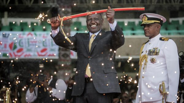 Kenya's new president William Ruto holds up a ceremonial sword as he is sworn in to office at a ceremony held at Kasarani stadium in Nairobi, Kenya Tuesday, Sept. 13, 2022. William Ruto was sworn in as Kenya's president on Tuesday after narrowly winning the Aug. 9 election and after the Supreme Court last week rejected a challenge to the official results by losing candidate Raila Odinga. - Sputnik International