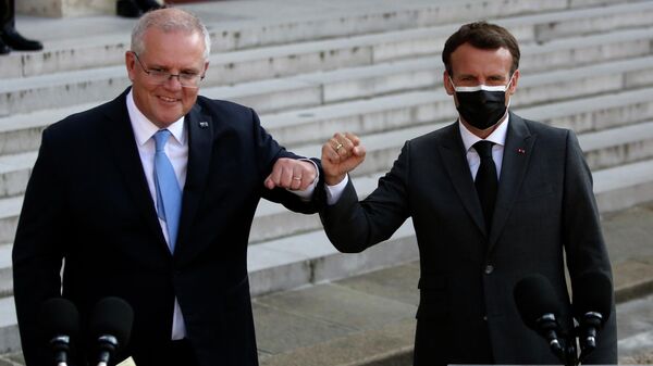 French President Emmanuel Macron, right, and Australia's Prime Minister Scott Morrison greet during a joint press conference with before a working dinner at the Elysee Palace in Paris, Tuesday, June 15, 2021. - Sputnik International