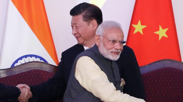 FILE- Indian Prime Minister Narendra Modi, front and Chinese President Xi Jinping  - Sputnik International
