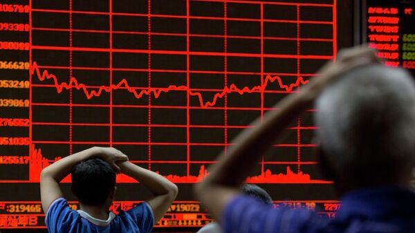 FILE - In this Monday, Aug. 31, 2015, file photo, investors monitor a display showing the Shanghai Composite Index at a brokerage in Beijing. From Australia to Zambia, Chile to Indonesia, the pain of China’s sharp economic slowdown is being felt in the form of depressed commodity prices, elevated unemployment and shrunken home prices. - Sputnik International