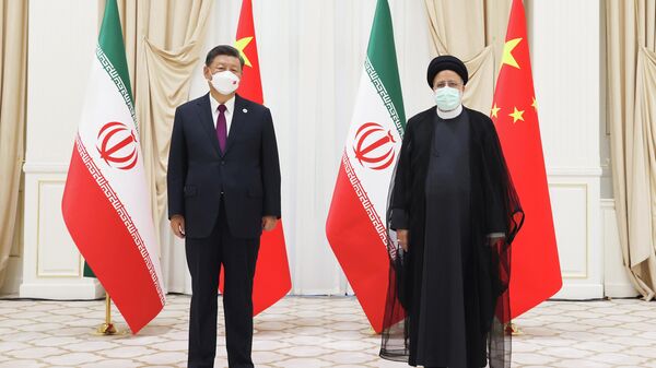 Chinese President Xi Jinping and Iranian President Ebrahim Raisi meet in Samarkand, Uzbekistan on the sidelines of the Shanghai Cooperation Organization summit. Friday, September 16, 2022. - Sputnik International