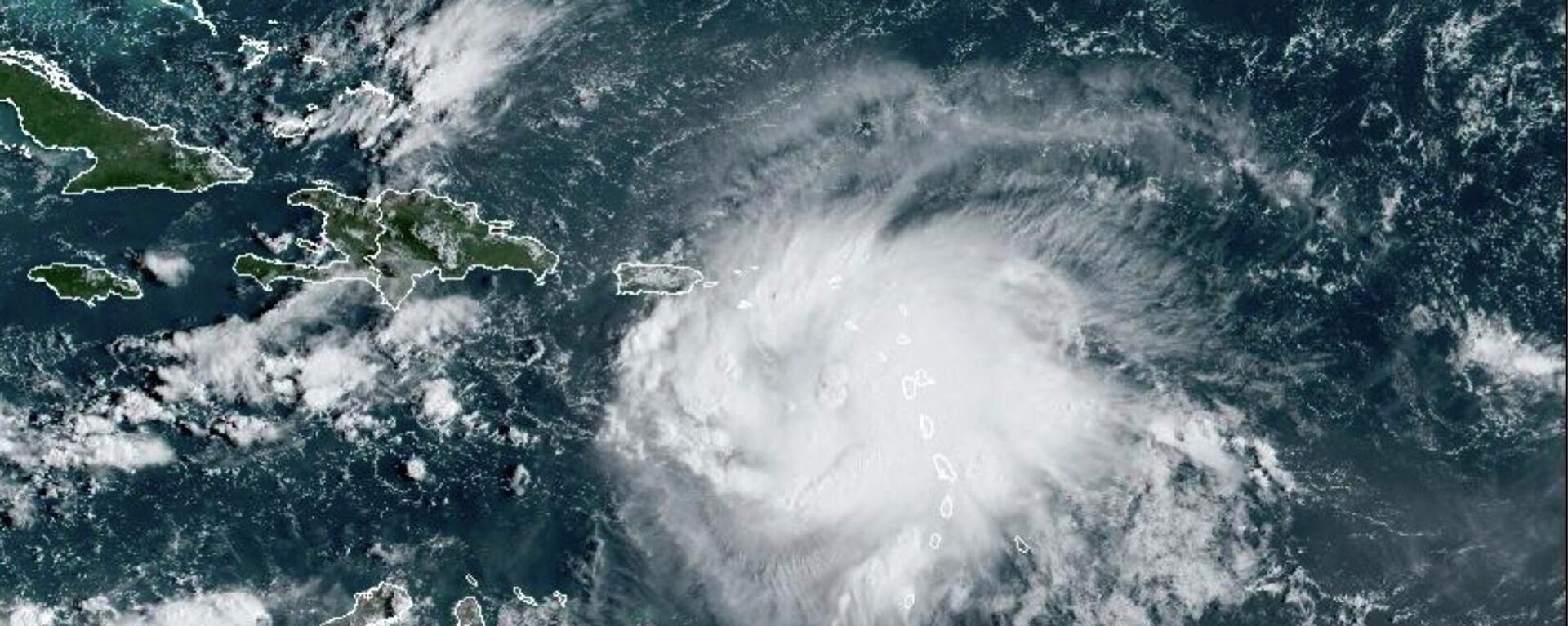 This satellite image provided by NOAA shows Tropical Storm Fiona in the Caribbean on Saturday, Sept. 17, 2022. Fiona threatened to dump up to 16 inches (41 centimeters) of rain in parts of Puerto Rico on Saturday as forecasters placed the U.S. territory under a hurricane watch and people braced for potential landslides, severe flooding and power outages.  - Sputnik International, 1920, 06.01.2023