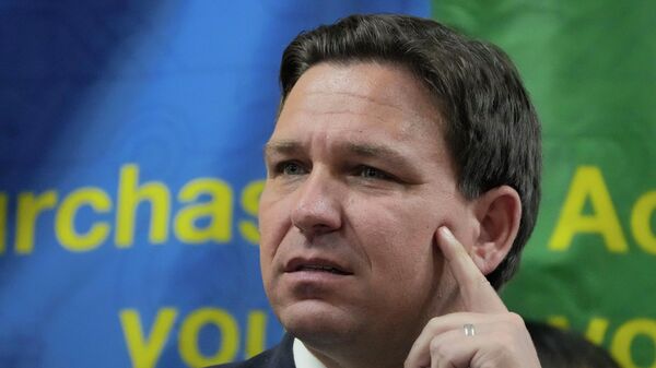 Florida Gov. Ron DeSantis listens to a question during a press conference announcing expanded toll relief for Florida commuters, Wednesday, Sept. 7, 2022, in Miami, Fla. - Sputnik International