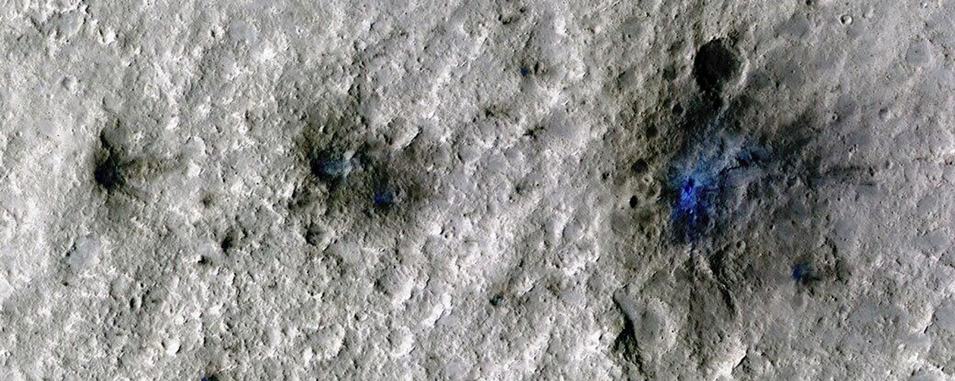 This undated photo released by NASA shows craters that were formed by a Sept. 5, 2021, meteoroid impact on Mars, the first to be detected by NASA’s InSight - Sputnik International, 1920, 20.09.2022