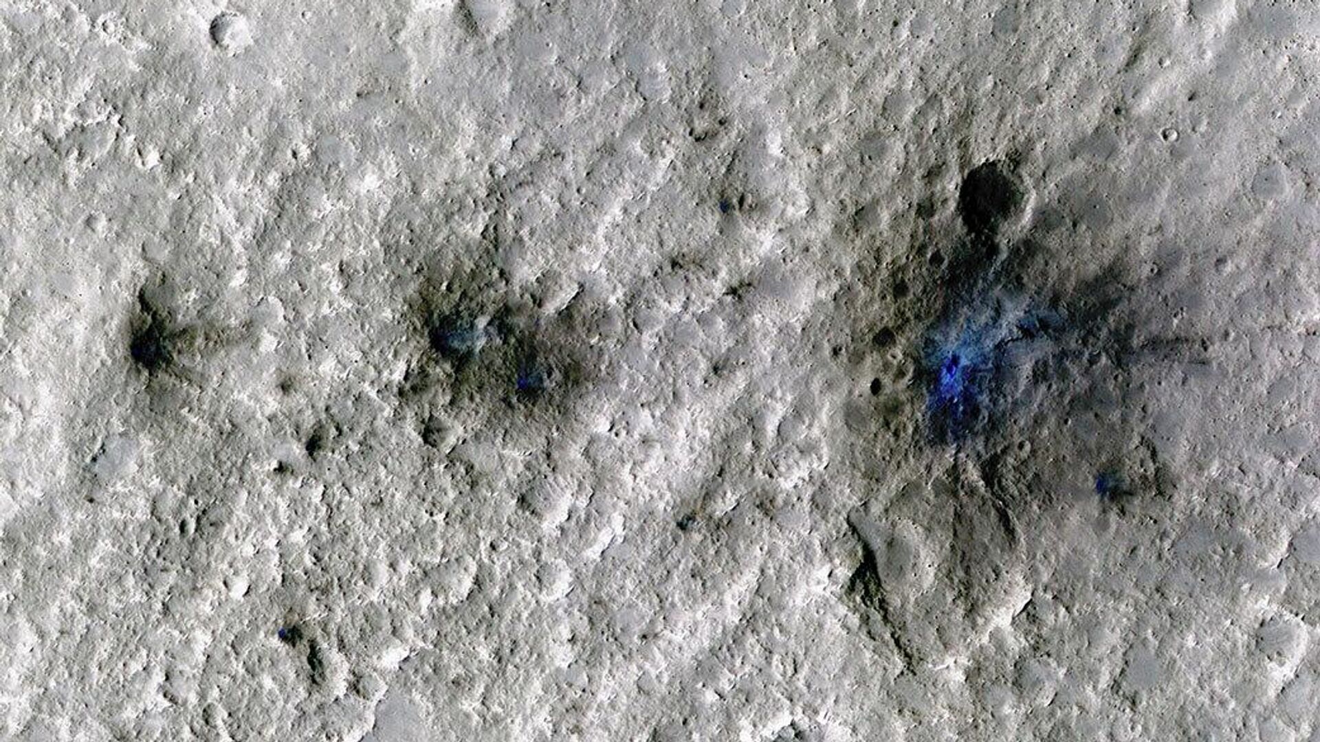 This undated photo released by NASA shows craters that were formed by a Sept. 5, 2021, meteoroid impact on Mars, the first to be detected by NASA’s InSight - Sputnik International, 1920, 20.09.2022