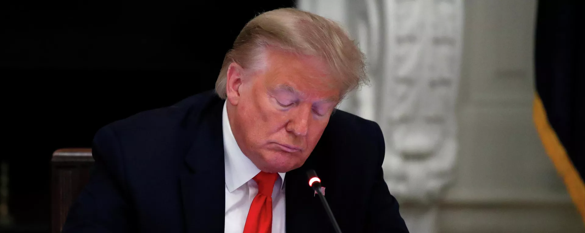 President Donald Trump looks at his phone during a roundtable with governors on the reopening of America's small businesses, in the State Dining Room of the White House in Washington, June 18, 2020 - Sputnik International, 1920, 15.11.2024