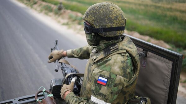 Russian serviceman is seen in the southern sector in the course of Russia's military operation in Ukraine, at the unknown location - Sputnik International