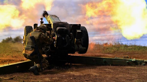 A serviceman of Russian private military company Wagner Group shoots from a 122 mm D30 howitzer at the Ukrainian positions, as Russia's military operation in Ukraine continues, in the suburbs of Bakhmut, Donetsk People's Republic - Sputnik International