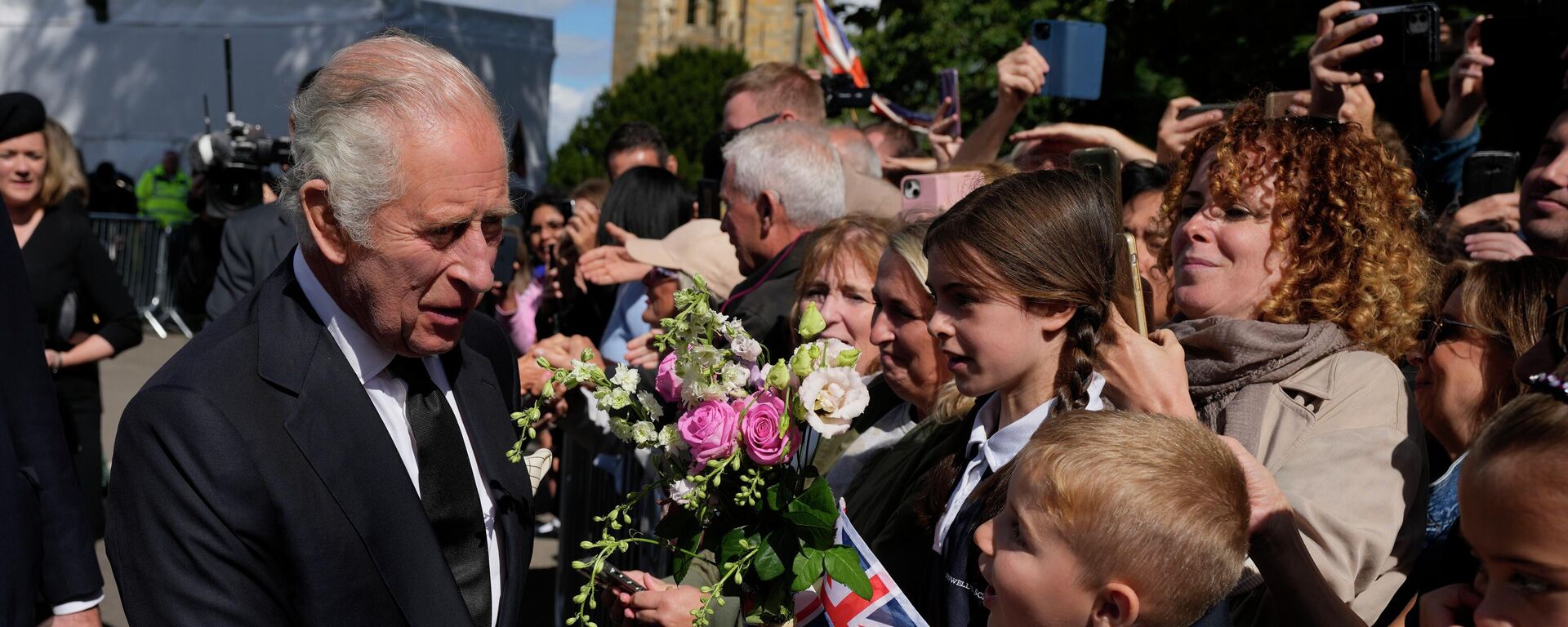 Britain's King Charles III shakes hands with a boy after a Service of Prayer and Reflection for the life of Queen Elizabeth II, at Llandaff Cathedral in Cardiff, Wales, Friday Sept. 16, 2022. The Royal couple has have arrived in Wales for an official visit. The royal couple previously visited to Scotland and Northern Ireland, the other nations making up the United Kingdom, following the death of Queen Elizabeth II at age 96 on Thursday, Sept. 8. (AP Photo/Frank Augstein, Pool) - Sputnik International, 1920, 07.12.2022