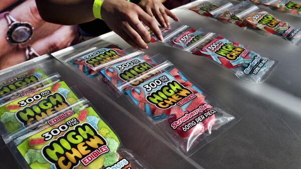 Medicated High Chew edibles are shown on display and offered for sale at the cannabis-themed Kushstock Festival at Adelanto, California - Sputnik International