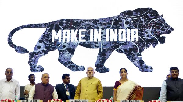 Indian Prime Minister Narendra Modi, center, unveils the logo of 'Make in India' initiative in New Delhi, India, Sept. 25, 2014. - Sputnik International