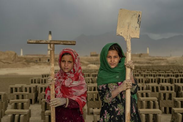 Two Afghan child laborers pose for a photo in a brick factory on the outskirts of Kabul, Afghanistan, Monday, Sept. 12, 2022.  - Sputnik International