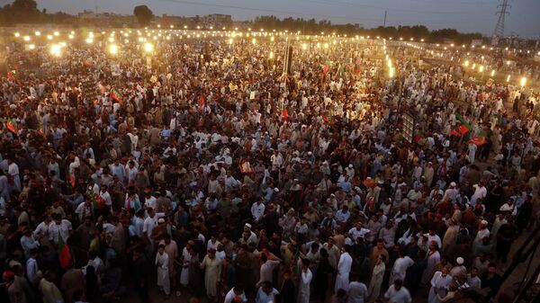 Supporters of Pakistani opposition leader Imran Khan's Tehreek-e-Insaf party attend a rally, in Peshawar, Pakistan, Tuesday, Sept. 6, 2022. - Sputnik International
