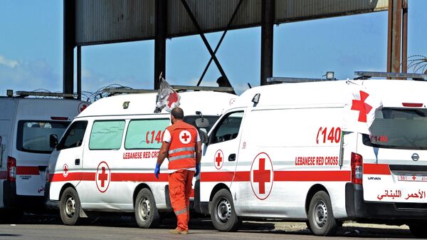 Ambulances wait on the Lebanese side of the Arida Border Crossing with Syria on September 23, 2022, for the arrival of the bodies of the shipwrecked Lebanese, who drowned when a boat they boarded sank off Syria's coast.  - Sputnik International