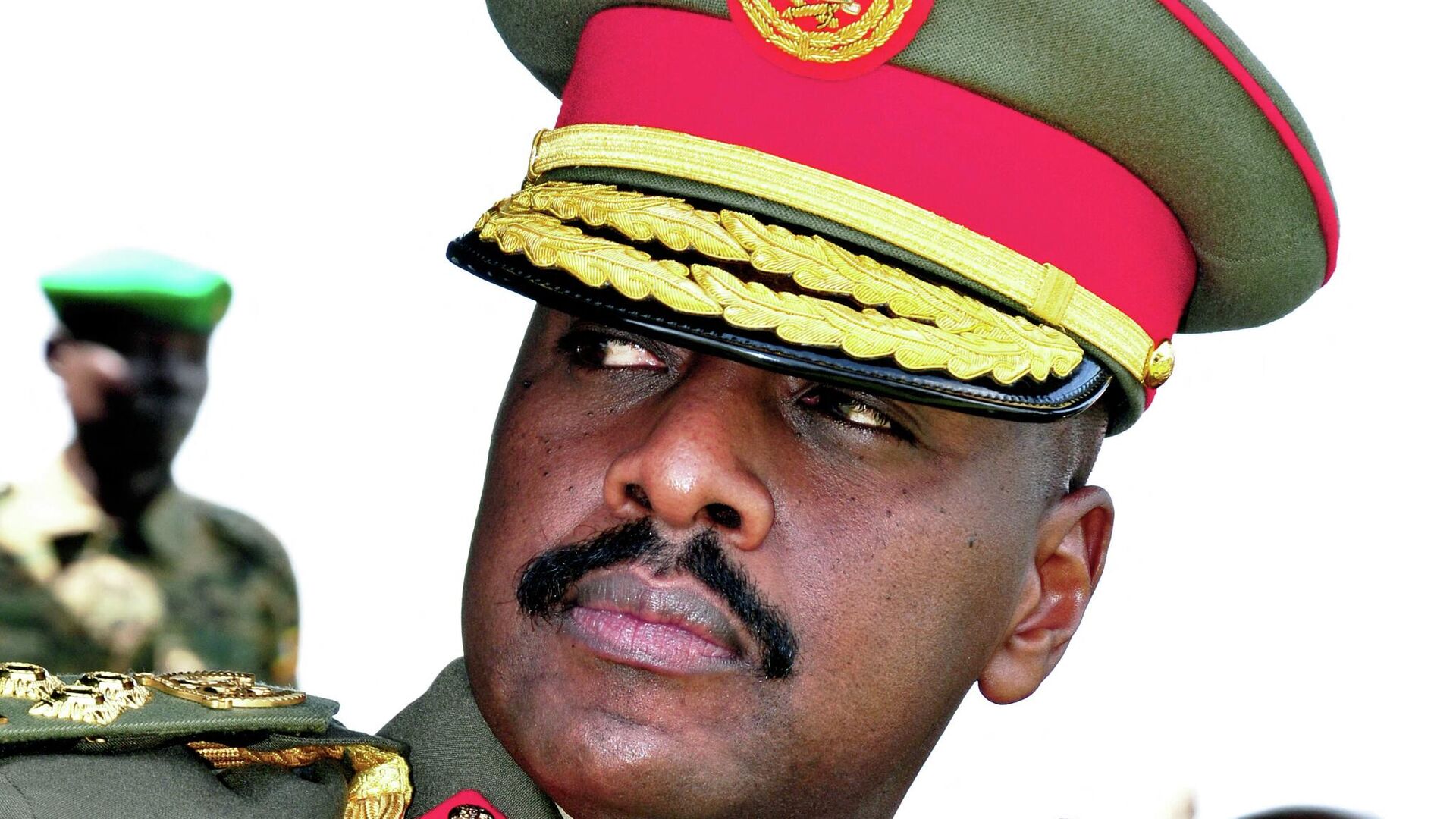 The son of Uganda's President Yoweri Museveni, Major General Muhoozi Kainerugaba attends a ceremony in which he was promoted from Brigadier to Major General at the country's military headquarters in Kampala on May 25, 2016. - The son of Uganda's President Yoweri Museveni, one of Africa's longest-serving leaders, has rejected claims that he plans to succeed his father, reports said Thursday. Muhoozi Kainerugaba, speaking on May 25 after he was promoted from Brigadier to Major General, heading the Special Forces Command (SFC), said he was happy with being in the military, the government-owned New Vision newspaper reported. (Photo by PETER BUSOMOKE / AFP) - Sputnik International, 1920, 25.09.2022