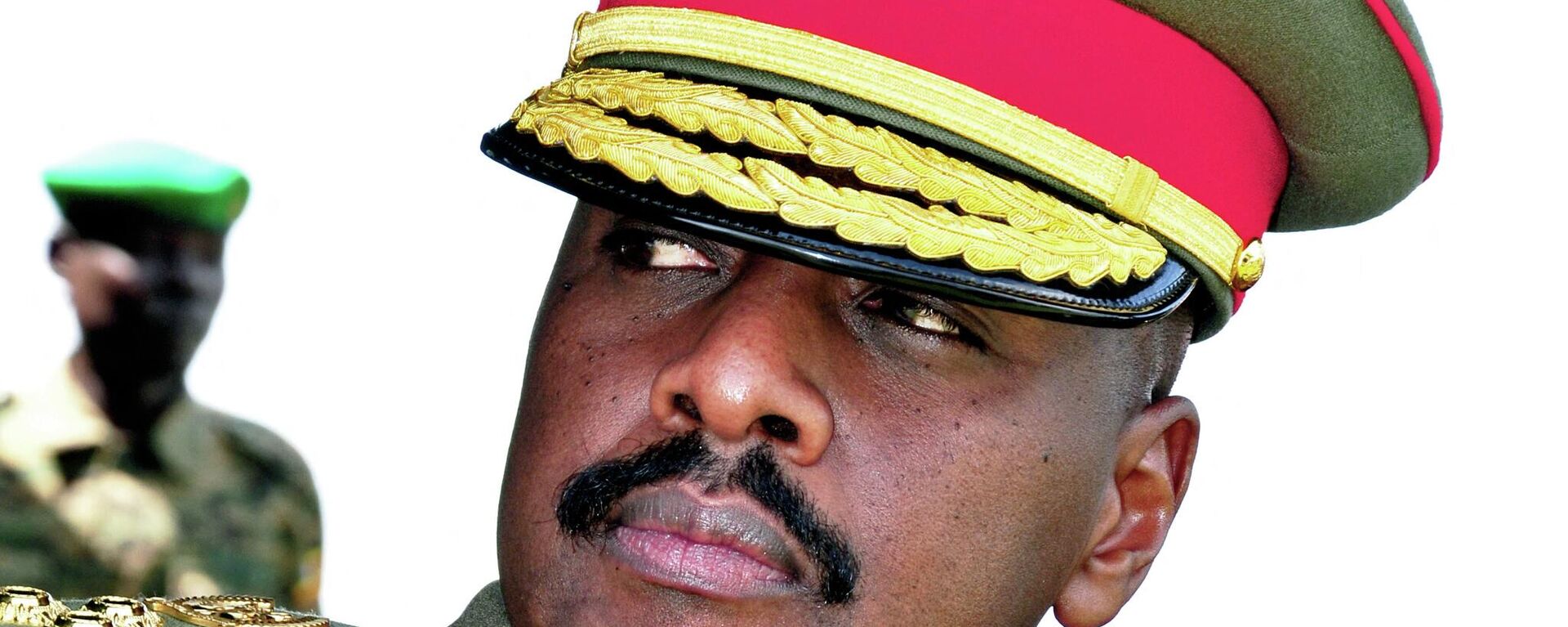 The son of Uganda's President Yoweri Museveni, Major General Muhoozi Kainerugaba attends a ceremony in which he was promoted from Brigadier to Major General at the country's military headquarters in Kampala on May 25, 2016. - The son of Uganda's President Yoweri Museveni, one of Africa's longest-serving leaders, has rejected claims that he plans to succeed his father, reports said Thursday. Muhoozi Kainerugaba, speaking on May 25 after he was promoted from Brigadier to Major General, heading the Special Forces Command (SFC), said he was happy with being in the military, the government-owned New Vision newspaper reported. (Photo by PETER BUSOMOKE / AFP) - Sputnik International, 1920, 25.09.2022