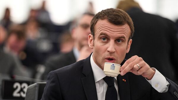 French President Emmanuel Macron drinks coffee as he sits after a speech at the European Parliament on April 17, 2018 in the eastern French city of Strasbourg. - Sputnik International