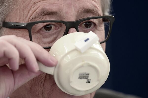 European Commission&#x27;s President Jean-Claude Juncker takes a drink as he attends a debate about the 13 November terrorist attacks in Paris and subsequent police and military operations at the European Parliament in Strasbourg on 25 November 2015. - Sputnik International