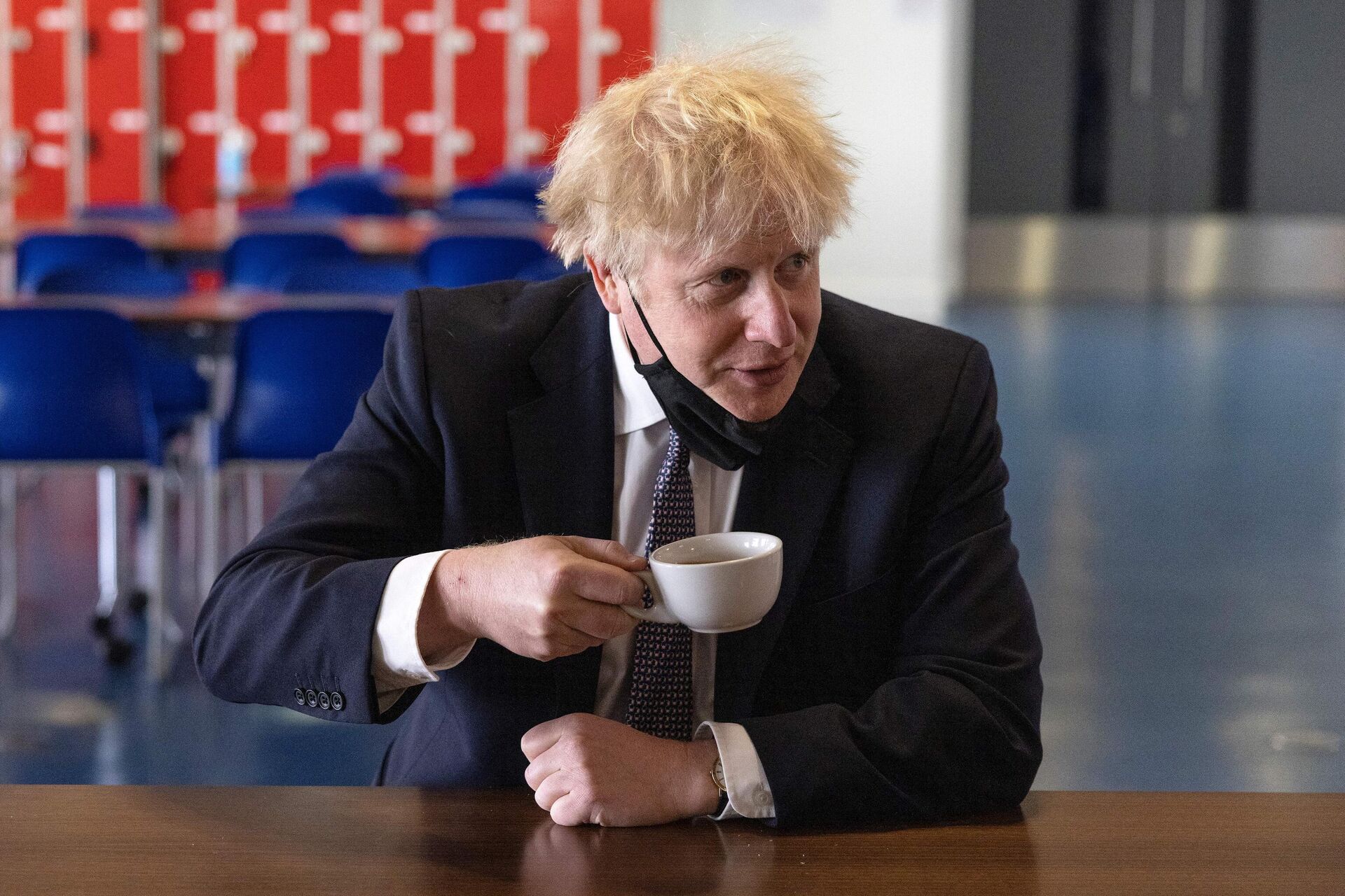 Britain's Prime Minister Boris Johnson, holds a cup of coffee as he speaks with pupils after taking part in a science lesson at King Solomon Academy in London, on April 29, 2021.  - Sputnik International, 1920, 05.10.2022