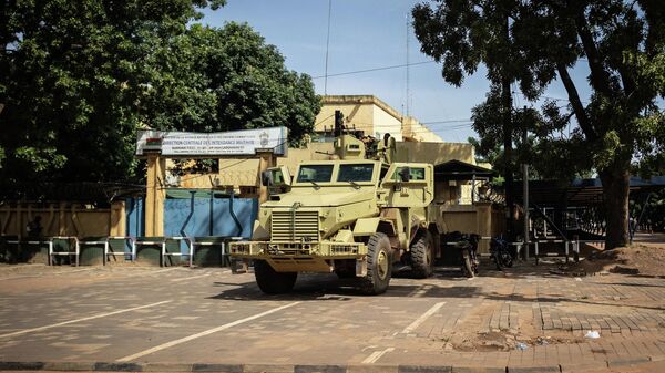 A military vehicle is seen in front of Burkina faso national television, In Ouagadougou on October 1, 2022 - Sputnik International