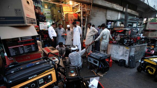In this Tuesday, May 28, 2013 file photo, Pakistani customers buying and getting their generators, which are widely used due to long hours of power cuts, in Rawalpindi, Pakistan. - Sputnik International