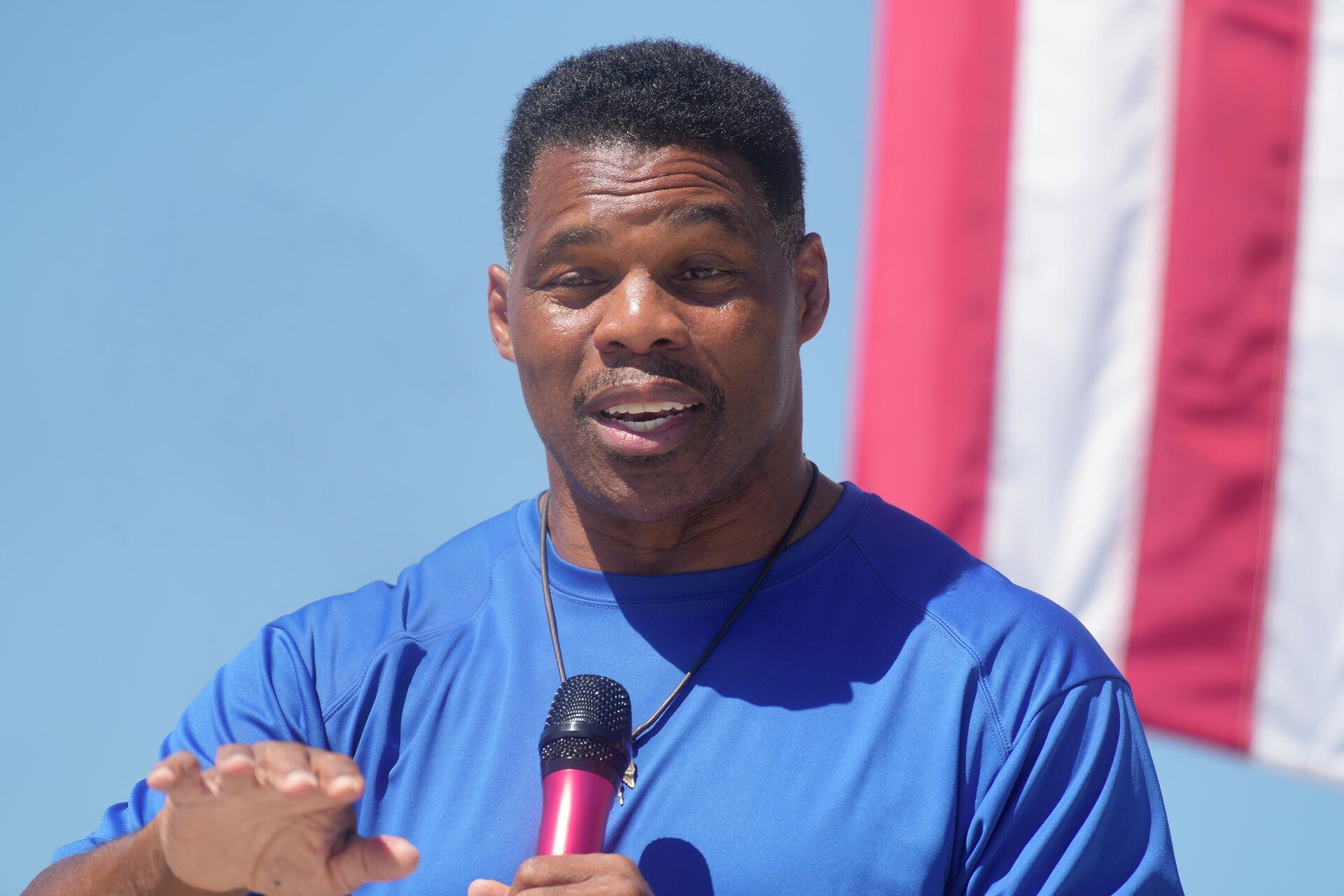 Georgia GOP Senate nominee Herschel Walker smiles during remarks during a campaign stop at Battle Lumber Co. on Thursday, Oct. 6, 2022, in Wadley, Ga. Walker's appearance was his first following reports that a woman who said Walker paid for her 2009 abortion is actually mother of one of his children - undercutting Walker's claims he didn't know who she was. - Sputnik International, 1920, 06.12.2022