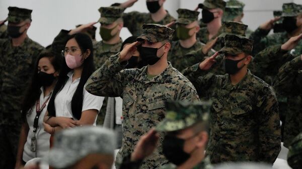 U.S. Marines salute during opening ceremonies of an annual joint military exercise called Kamandag the Tagalog acronym for Cooperation of the Warriors of the Sea at Fort Bonifacio, Taguig city, Philippines on Monday Oct. 3, 2022. - Sputnik International