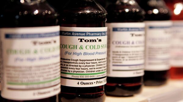 Pharmacist Tom Marks' cough syrups sit on the shelf at the Martin Avenue Pharmacy, Thursday, Oct. 6, 2005, in Naperville, Ill. - Sputnik International