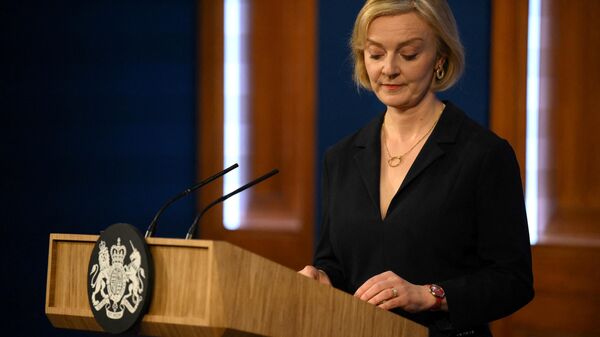 Britain's Prime Minister Liz Truss looks down during a press conference in the Downing Street Briefing Room in central London on October 14, 2022 - Sputnik International