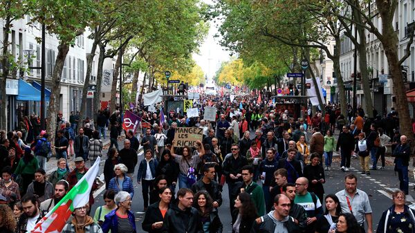 People gather for a march against the high cost of living and climate inaction in Paris, France, Sunday Oct. 16, 2022.  - Sputnik International