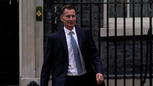 British Chancellor of the Exchequer Jeremy Hunt leaves 10 Downing Street after being appointed by Prime Minister Liz Truss - Sputnik International