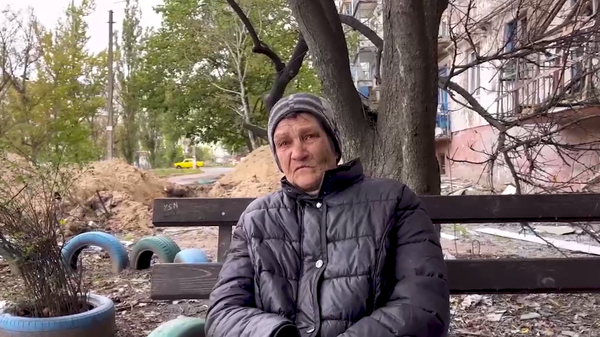 Natalia Petrovna, a 68-year-old resident of the small Lugansk People's Republic city of Rubezhnoye. Screenshot of Telegram video by Sputnik's Wyatt Reed. - Sputnik International