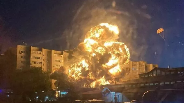 Photo taken by eyewitness shows Su-34 wreckage burning in Yeysk, southern Russia after a crash on October 17, 2022. - Sputnik International