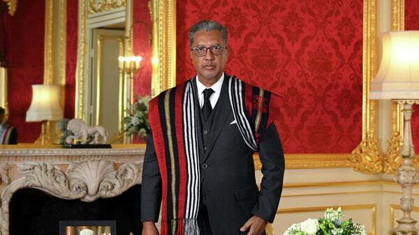 Foreign Minister of Madagascar Richard Randriamandrato stands before signing a book of condolence at Lancaster House following the death of Queen Elizabeth II, in London, Sunday, Sept. 18, 2022. - Sputnik International