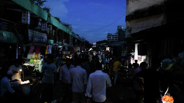 People walk through a dark street after a failure in Bangladesh's national power grid plunged much of the country into a blackout in Dhaka, Bangladesh, Tuesday, Oct.4, 2022. - Sputnik International